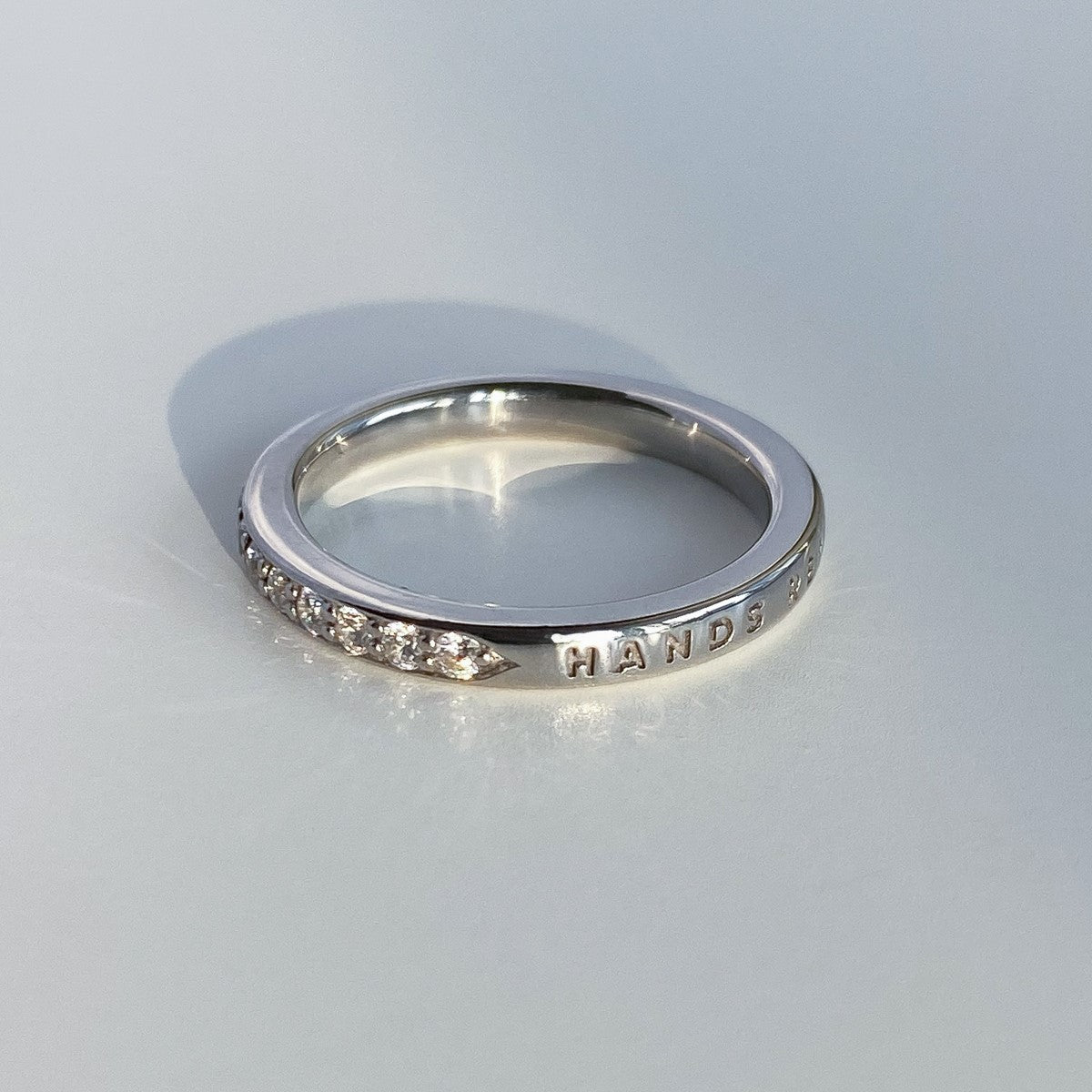 RING "MEMORIES" WITH A HALF CIRCLE OF MOISSANITE | SILVER