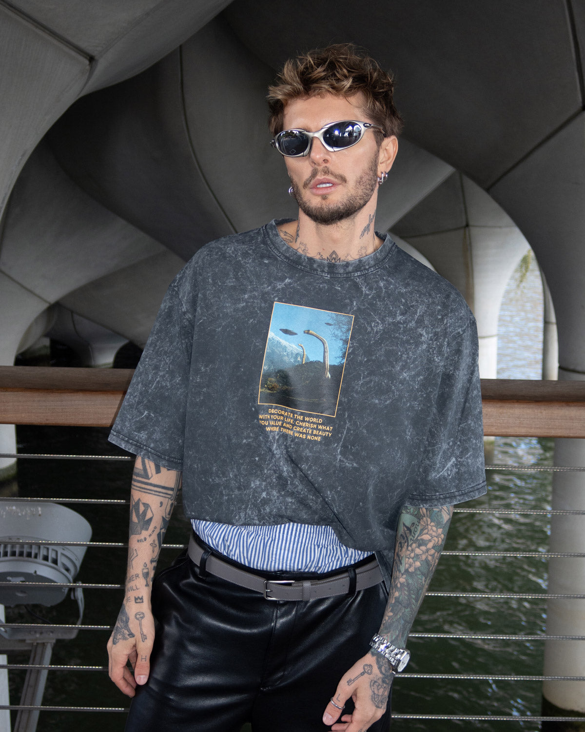 Oscar is wearing a graphic t-shirt with a print of dinosaurs