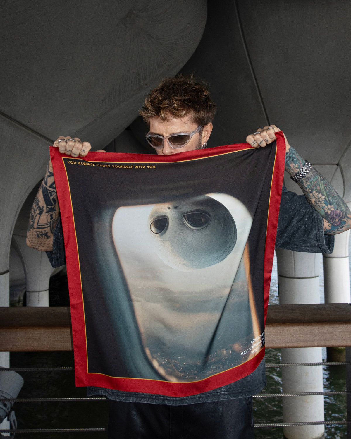 Scarf with a design of a window view from an airplane with an alien