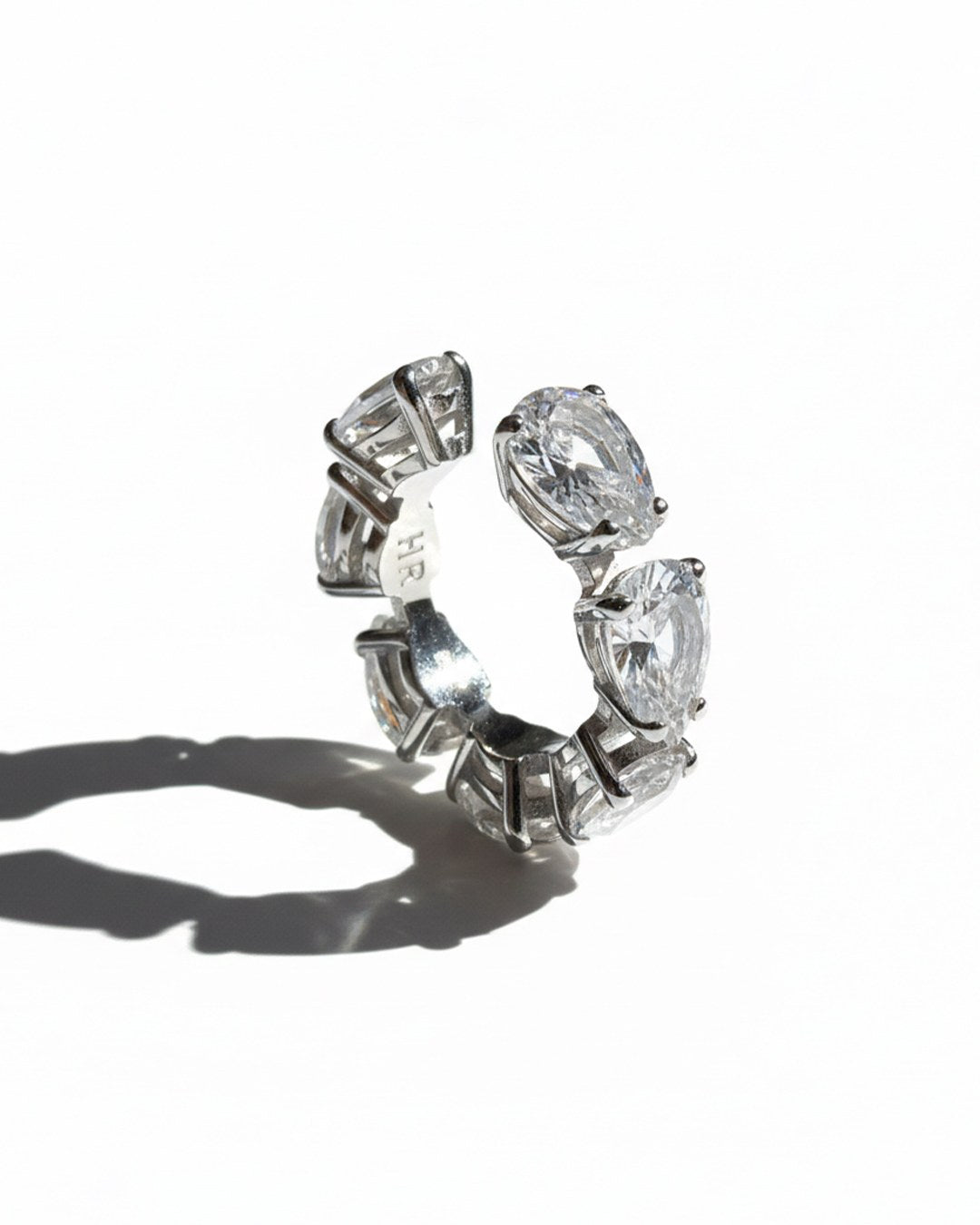 Minerals Maxi ear cuff in sterling silver with 7 pear-cut rock crystals, upright side view.
