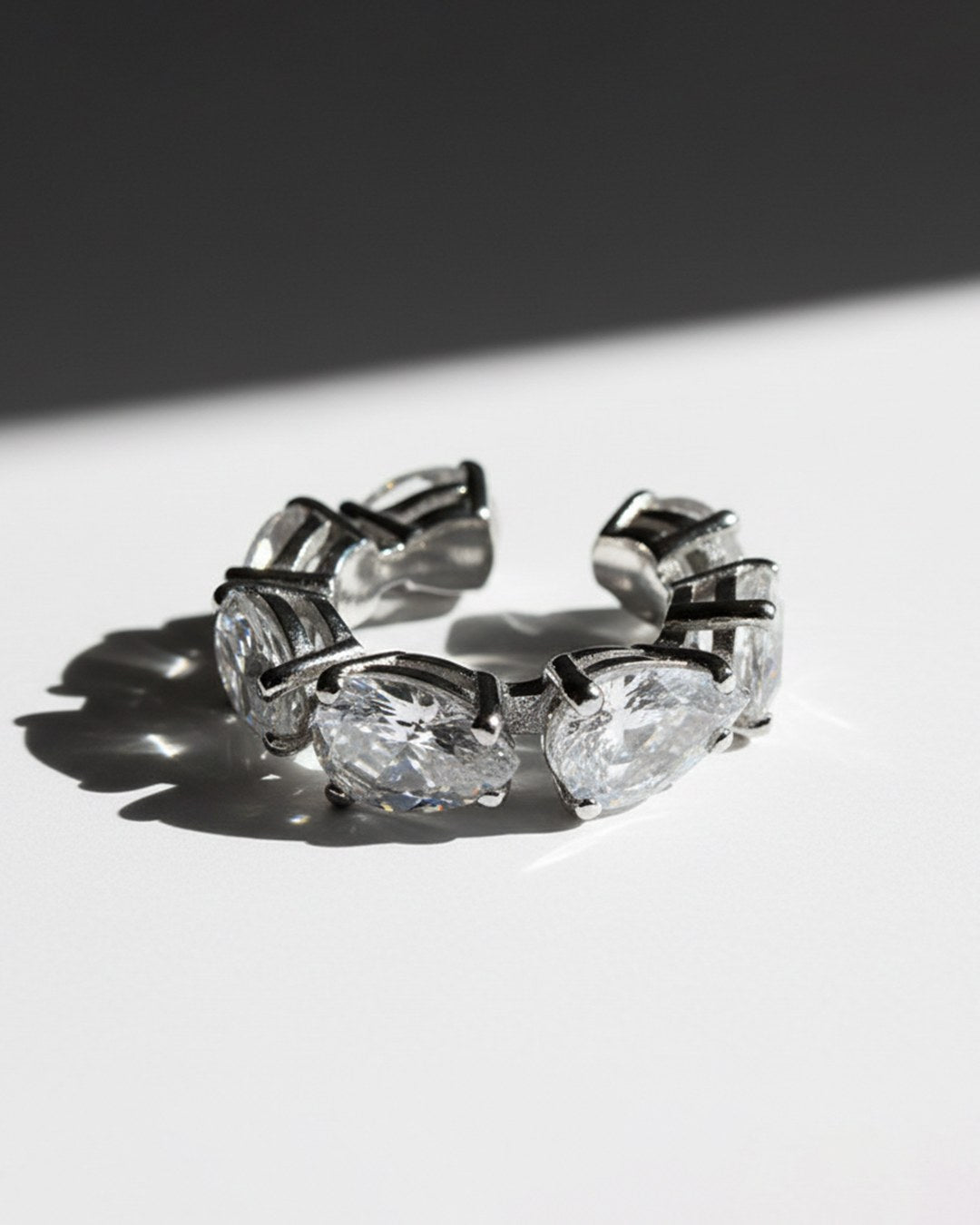 Minerals Maxi ear cuff in sterling silver with 7 pear-cut rock crystals, low angled view.