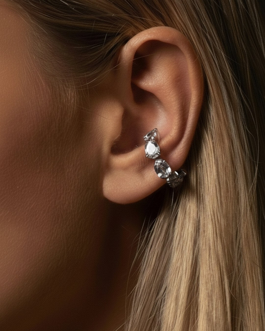 Minerals Maxi ear cuff in sterling silver with 7 pear-cut rock crystals, front view.