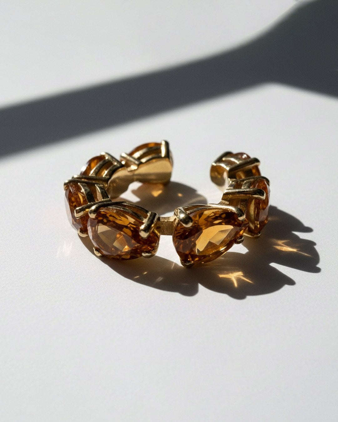 1. Minerals Maxi ear cuff in gold-plated sterling silver with 7 pear-cut yellow citrines, angled view.