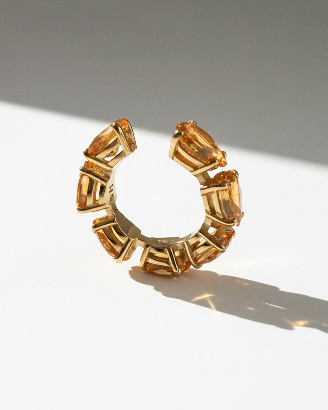Minerals Maxi ear cuff in gold-plated sterling silver with 7 pear-cut yellow citrines, front view.