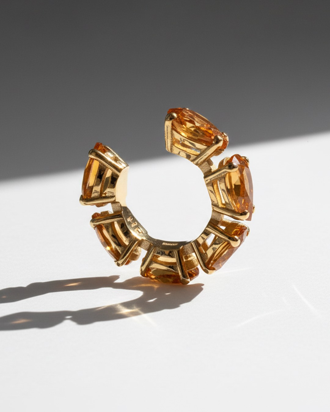 Minerals Mini ear cuff in gold-plated sterling silver with 6 pear-cut yellow citrines, upright back view.
