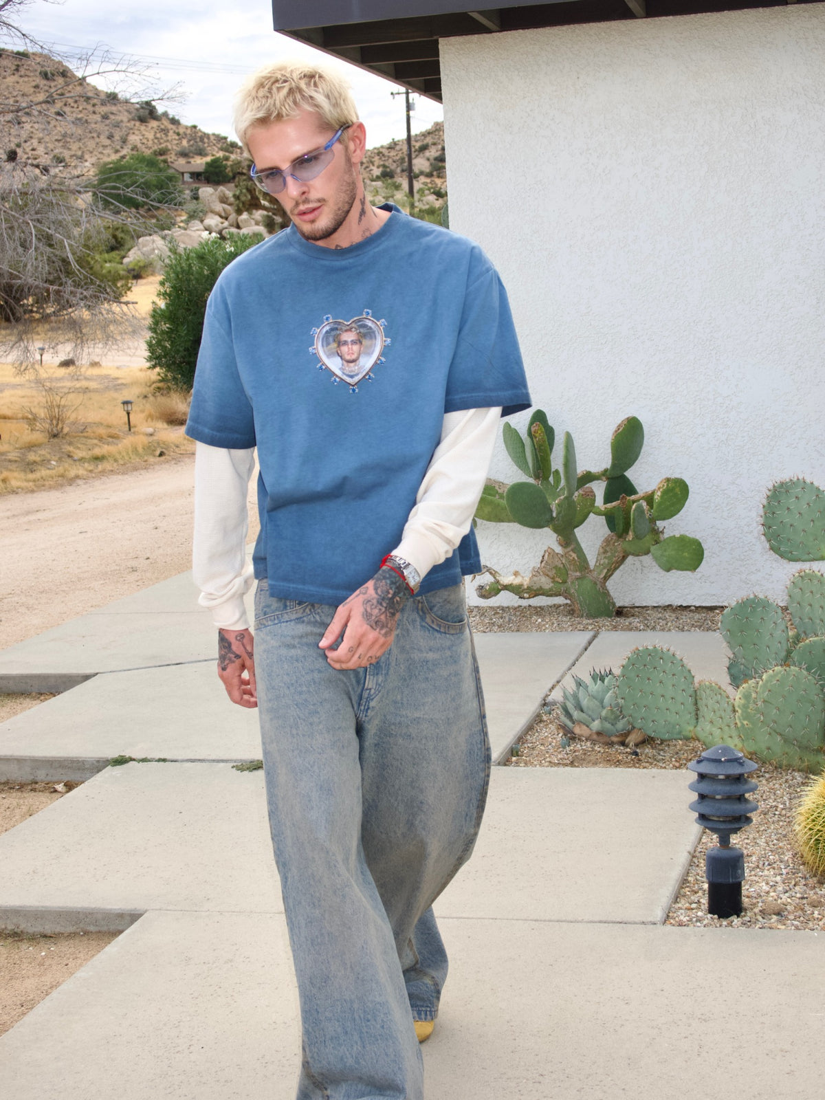 Blue long-sleeve T-shirt with the Oscar in My Heart print and contrasting white sleeves, walking front view
