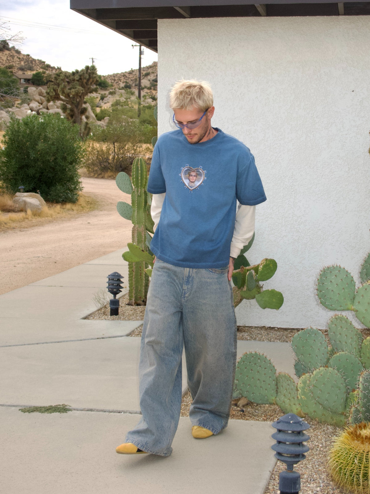 Blue long-sleeve T-shirt with the Oscar in My Heart print and contrasting white sleeves, full-length lifestyle view