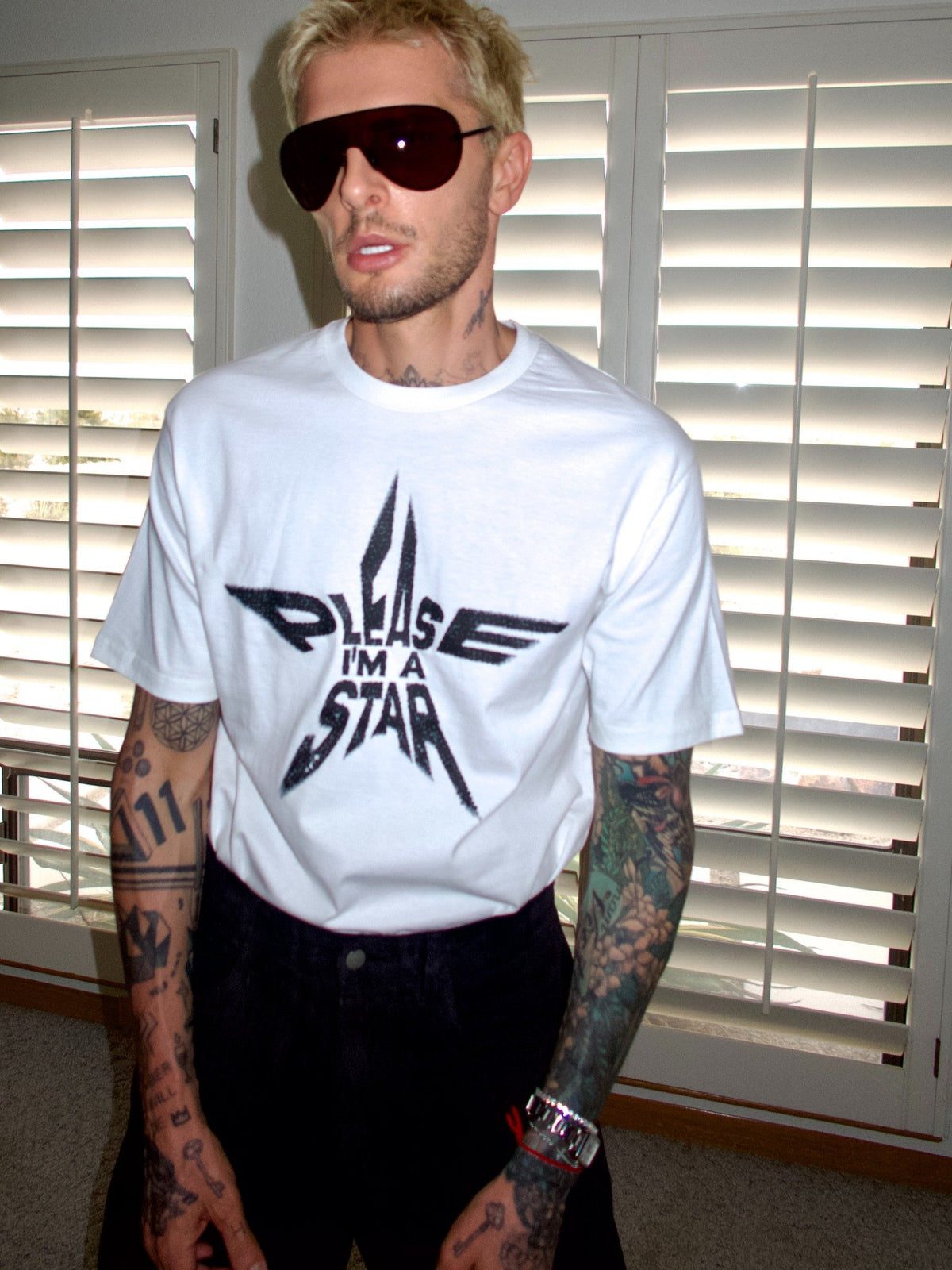 White T-shirt with the “Please, I’m a Star” statement graphic, close-up front view.