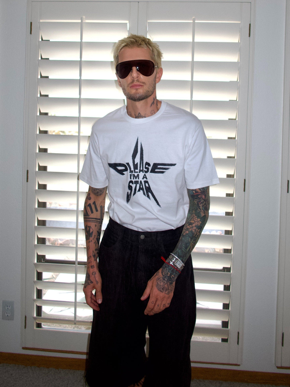 White T-shirt with the “Please, I’m a Star” statement graphic, standing front view.
