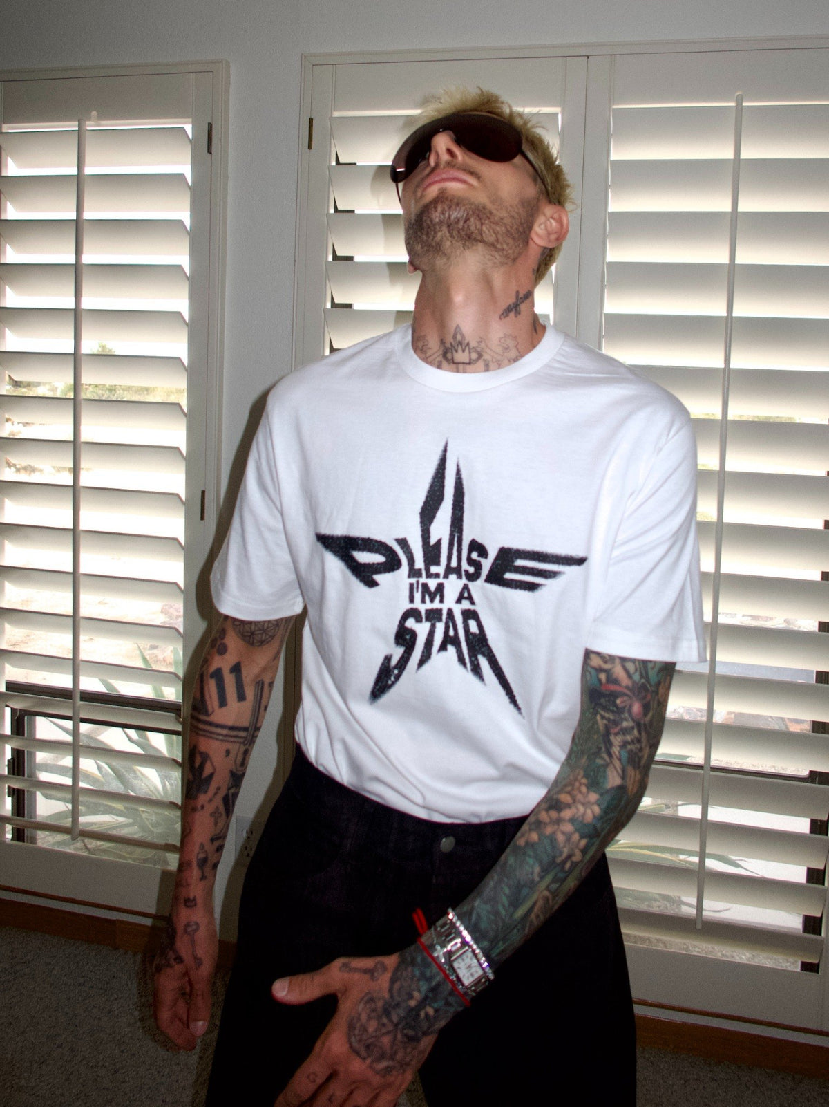 White T-shirt with the “Please, I’m a Star” statement graphic, portrait front view.