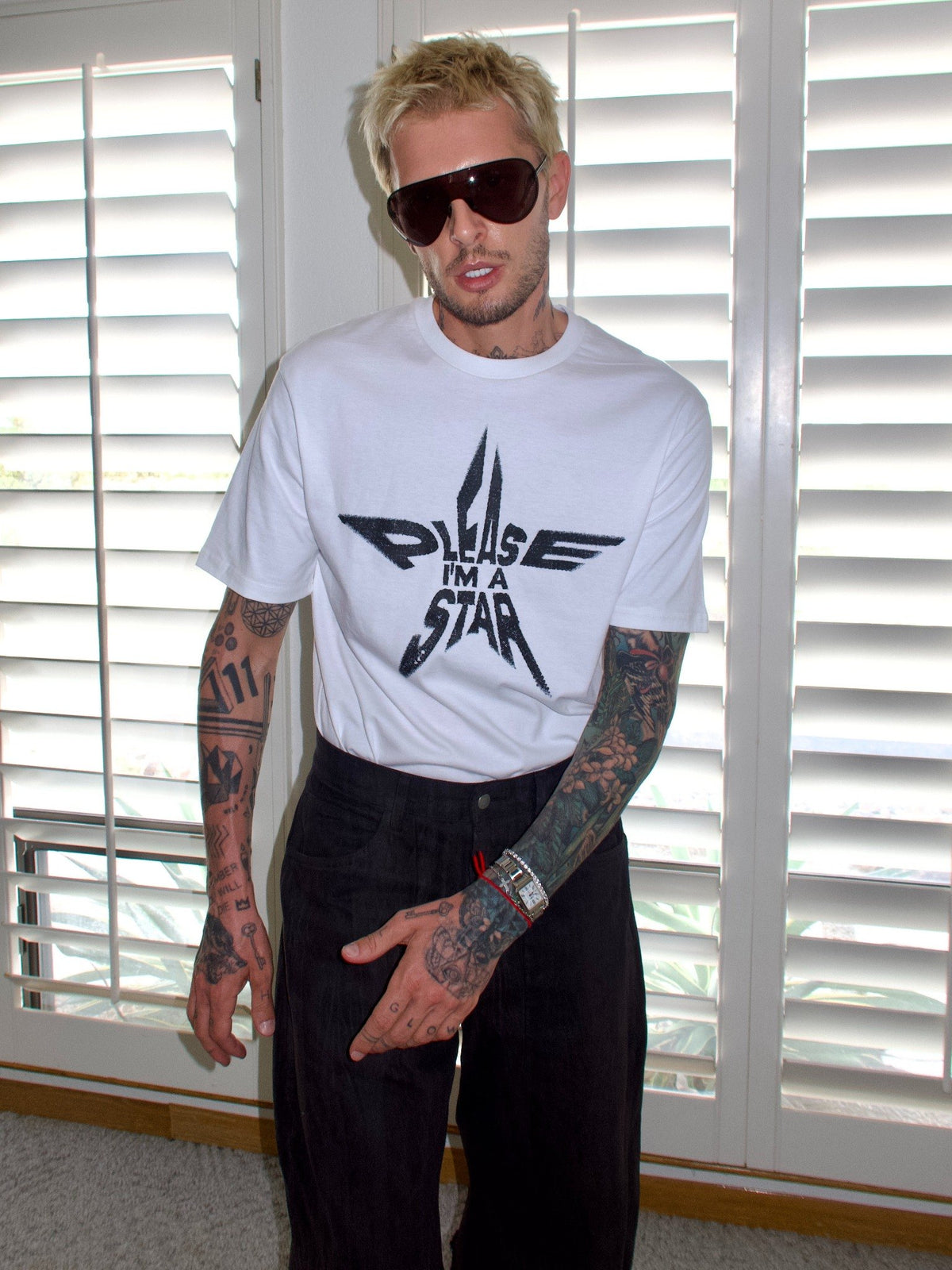 White T-shirt with the “Please, I’m a Star” statement graphic, full-length front view.